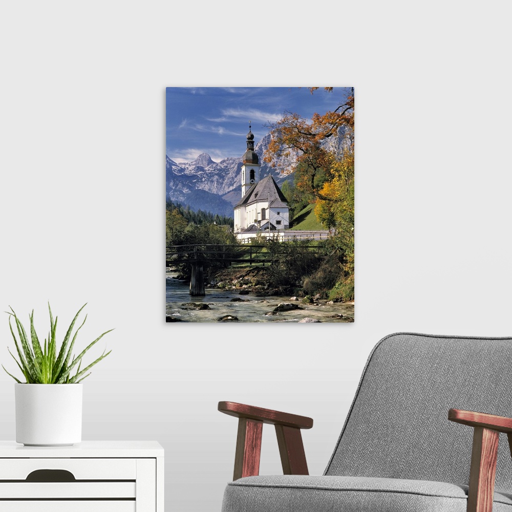 A modern room featuring Germany, Bavaria, Ramsau. The Ramsauer Ache flows by the church, or Kunterwegkirche, at Ramsau in...