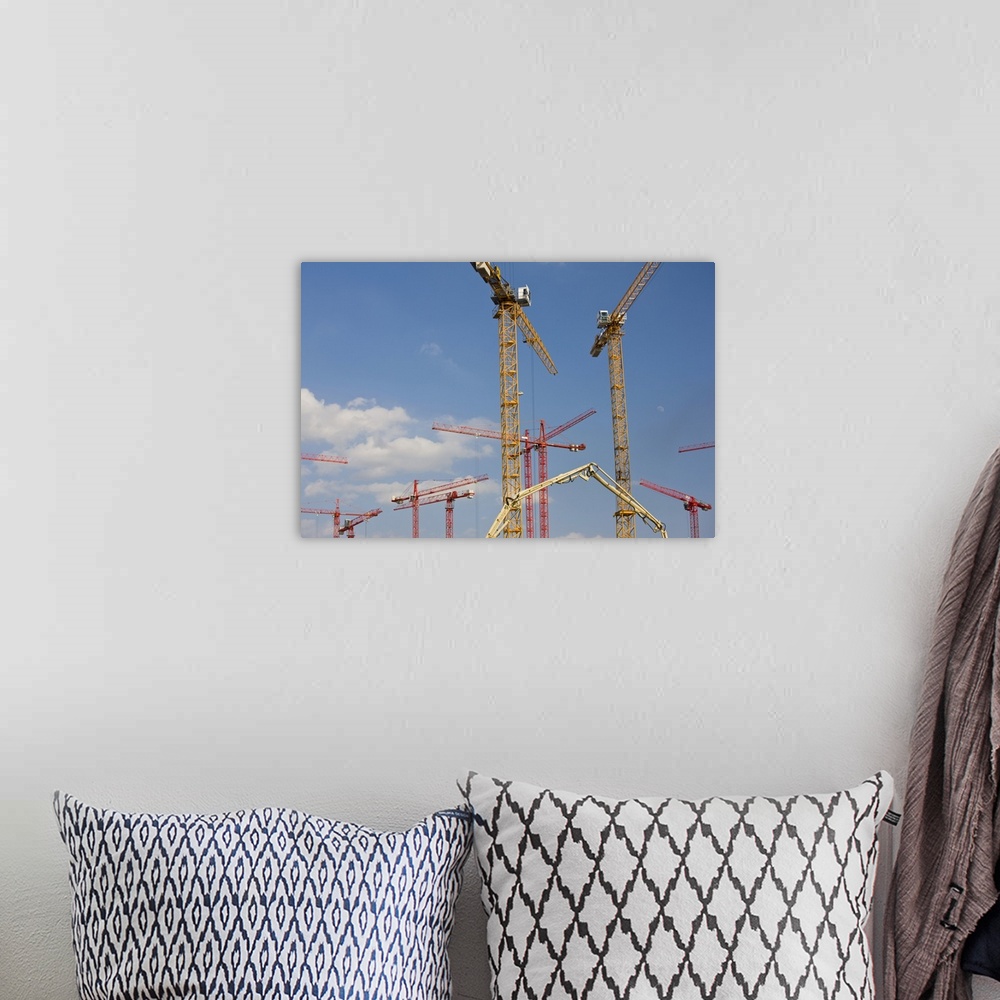 A bohemian room featuring Germany, State of Hamburg, Hamburg. Construction cranes, HafenCity.