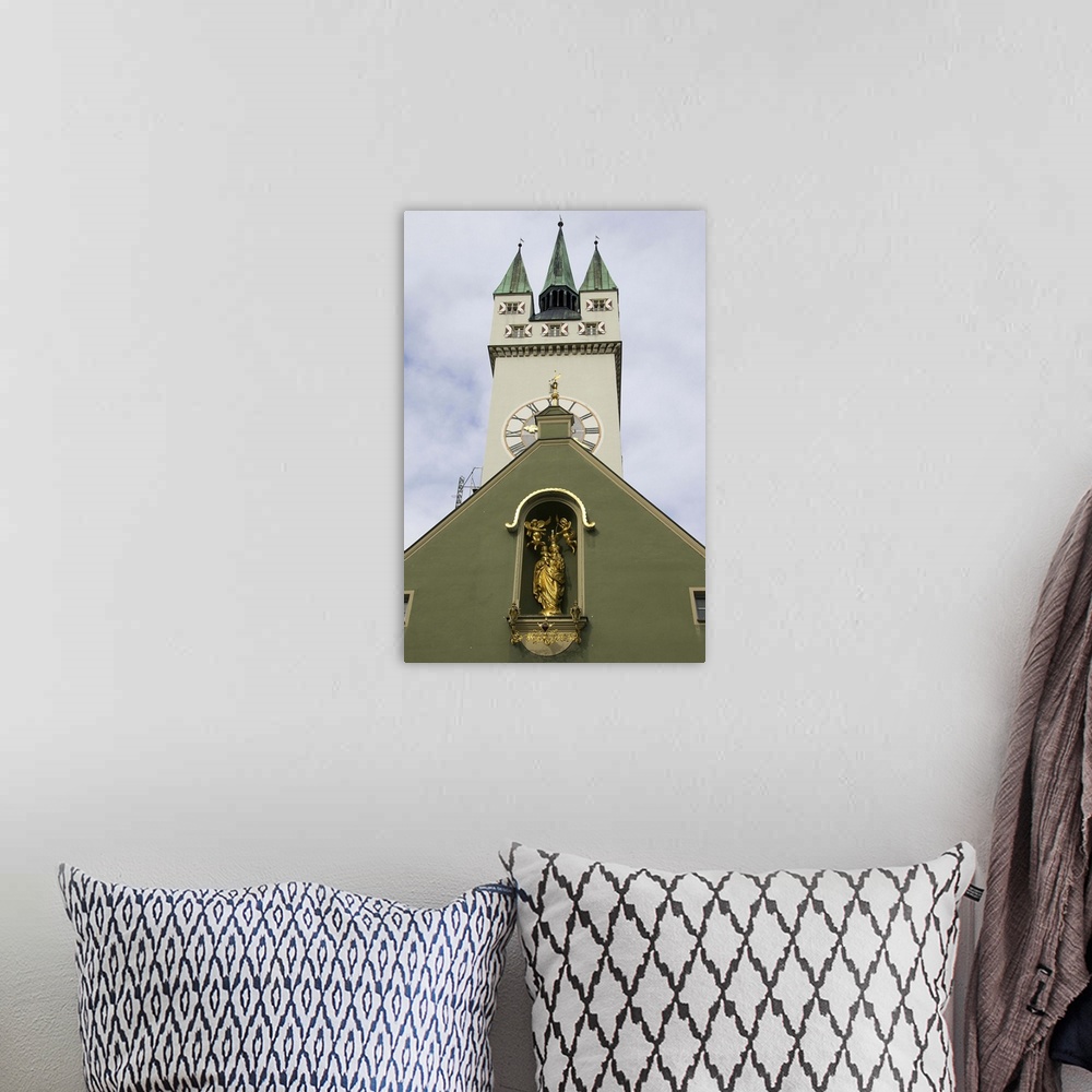 A bohemian room featuring Germany, Straubing, clock tower on church