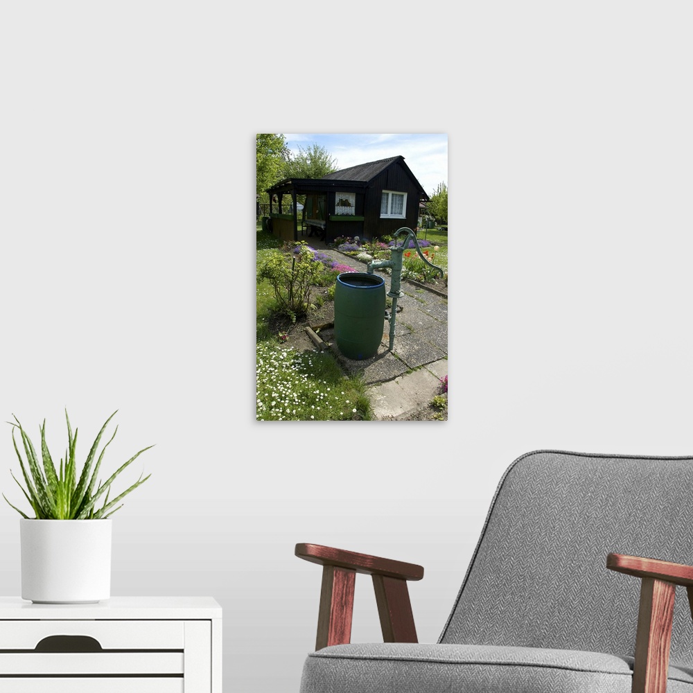 A modern room featuring Germany, Straubing, water barrel and pump in cottage garden in Spring
