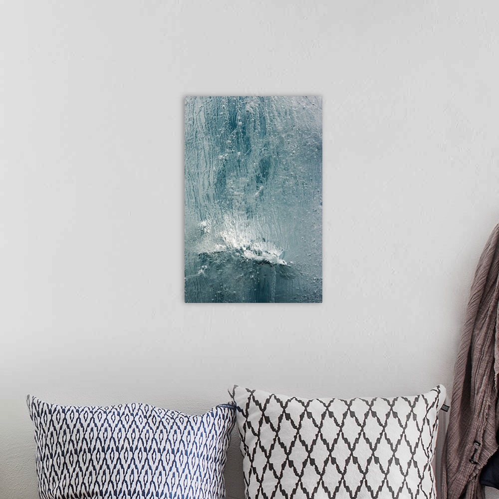 A bohemian room featuring Norway, Svalbard, Spitsbergen Island, Detail of patterns in face of iceberg floating near face of...