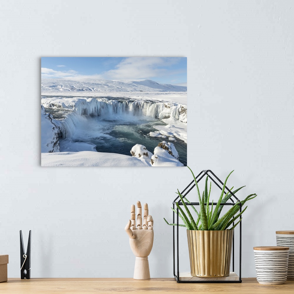 A bohemian room featuring Godafoss waterfall of Iceland during winter..
