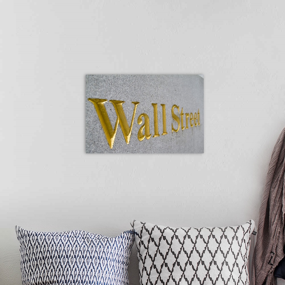 A bohemian room featuring Gold letters on  Wall Street in New York City USA