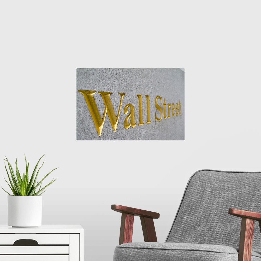 A modern room featuring Gold letters on  Wall Street in New York City USA