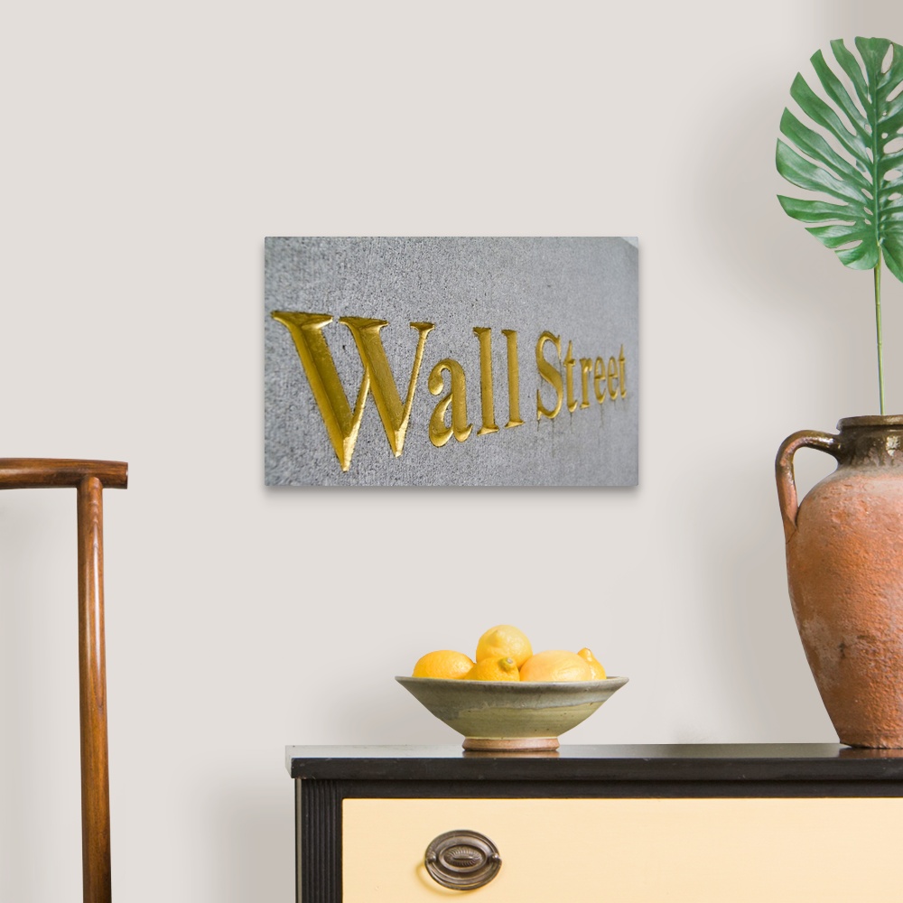 A traditional room featuring Gold letters on  Wall Street in New York City USA