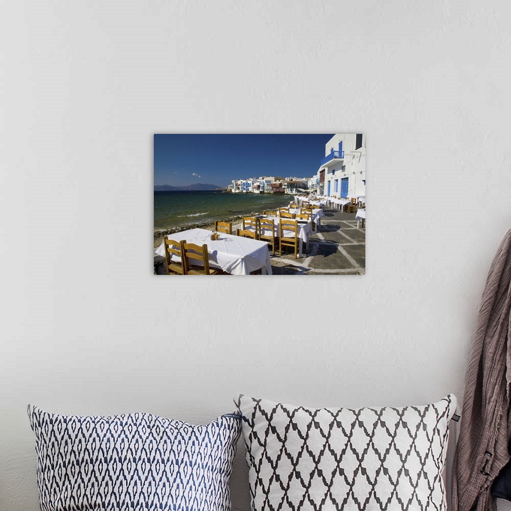 A bohemian room featuring Greece and Greek Island of Mykonos and the harbor town of Hora along the shoreline of little Veni...