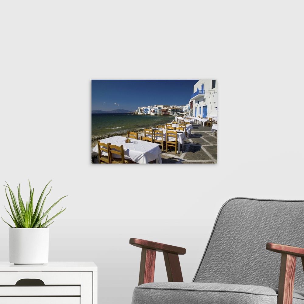 A modern room featuring Greece and Greek Island of Mykonos and the harbor town of Hora along the shoreline of little Veni...