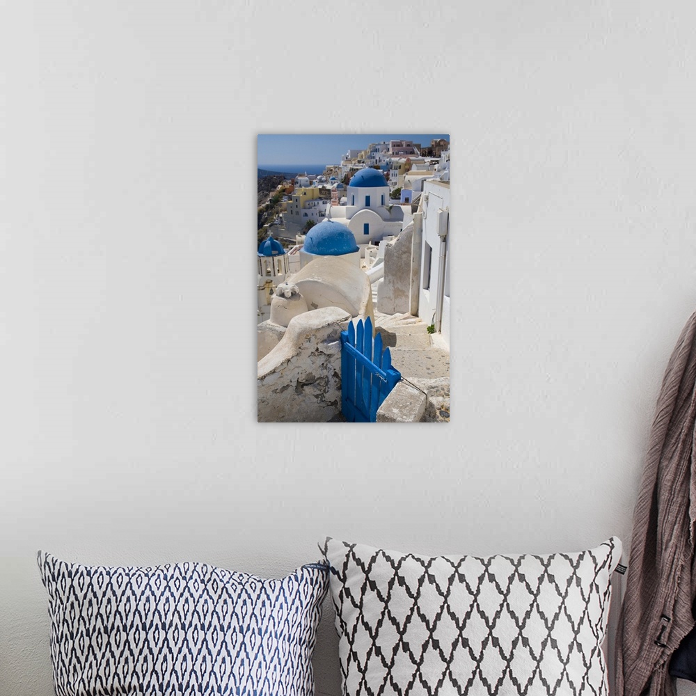 A bohemian room featuring Greece and Greek Island of Santorini town of Oia with Blue Domed Churches with white and colorful...
