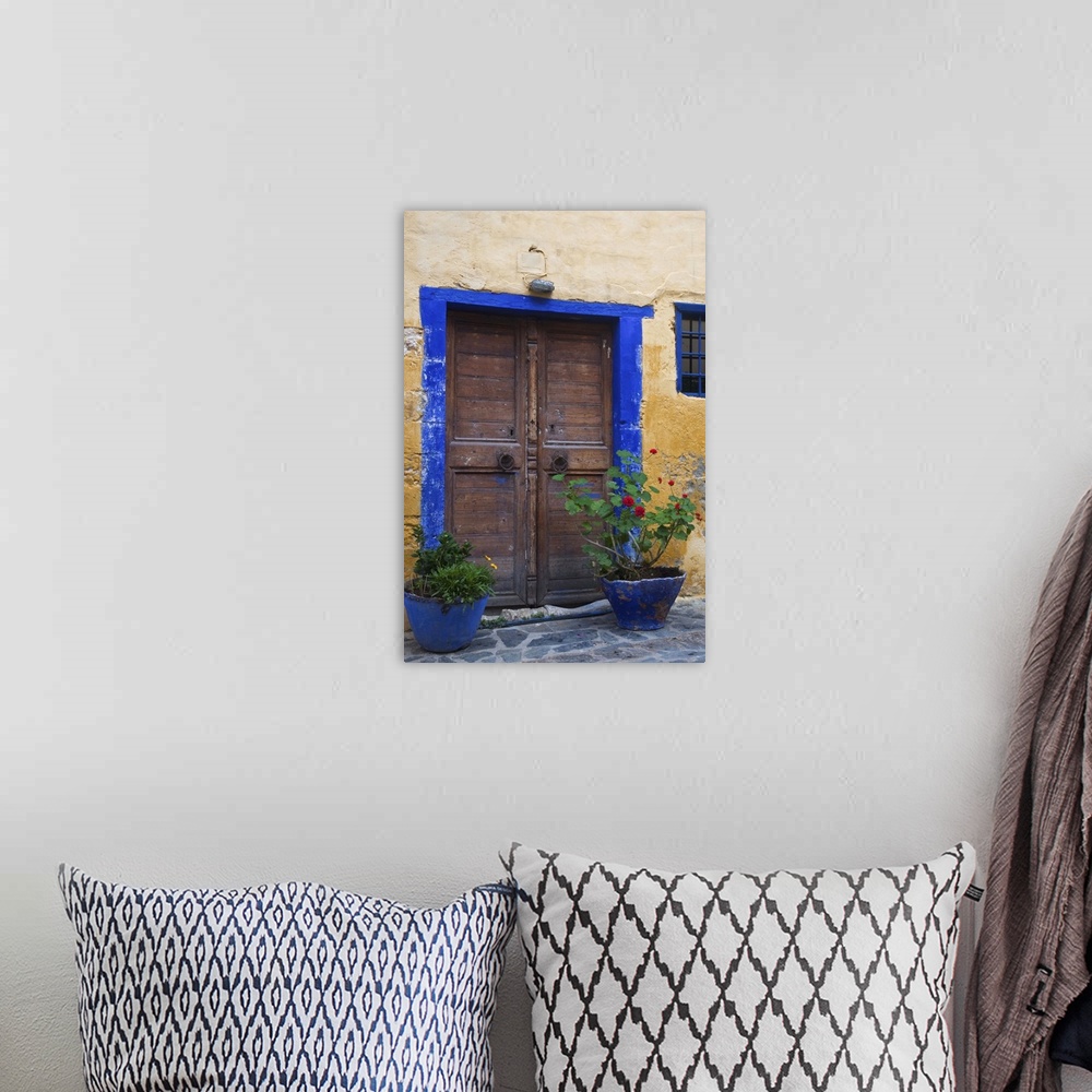 A bohemian room featuring Europe, Greece, Greek Island, Crete, Chania old town with colorful doorway to Turkish Restaurant