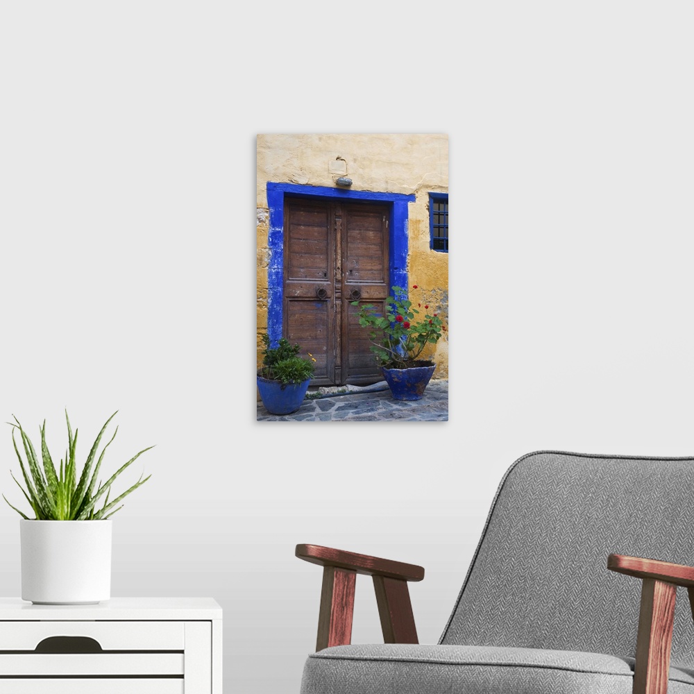 A modern room featuring Europe, Greece, Greek Island, Crete, Chania old town with colorful doorway to Turkish Restaurant