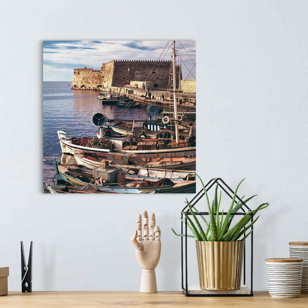 A bohemian room featuring Europe, Greece, Iraklion. Fishing boats are moored at the old port near the Rossa al Mare at Irak...