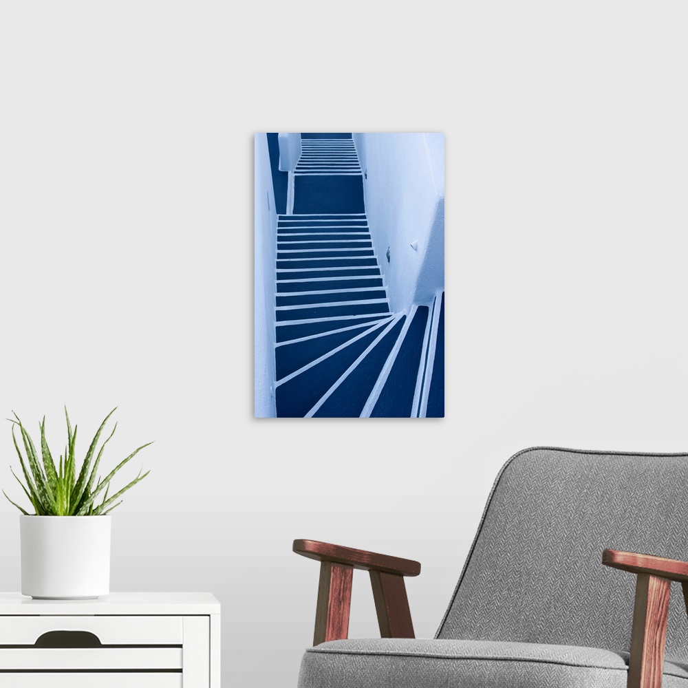 A modern room featuring Europe, Greece, Santorini. Looking down on painted blue and white stairway.