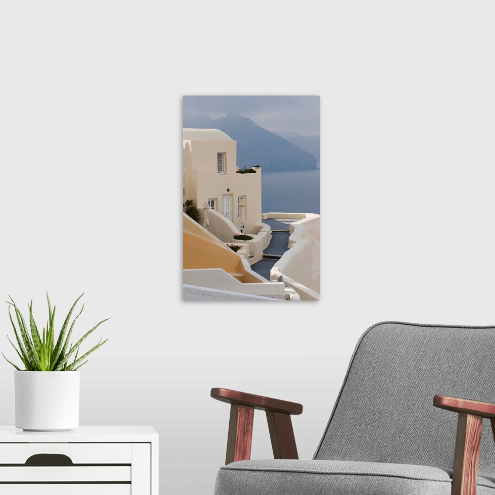 A modern room featuring Europe, Greece, Santorini, Thira, Oia. Pathway to end villa overlooking the sea.