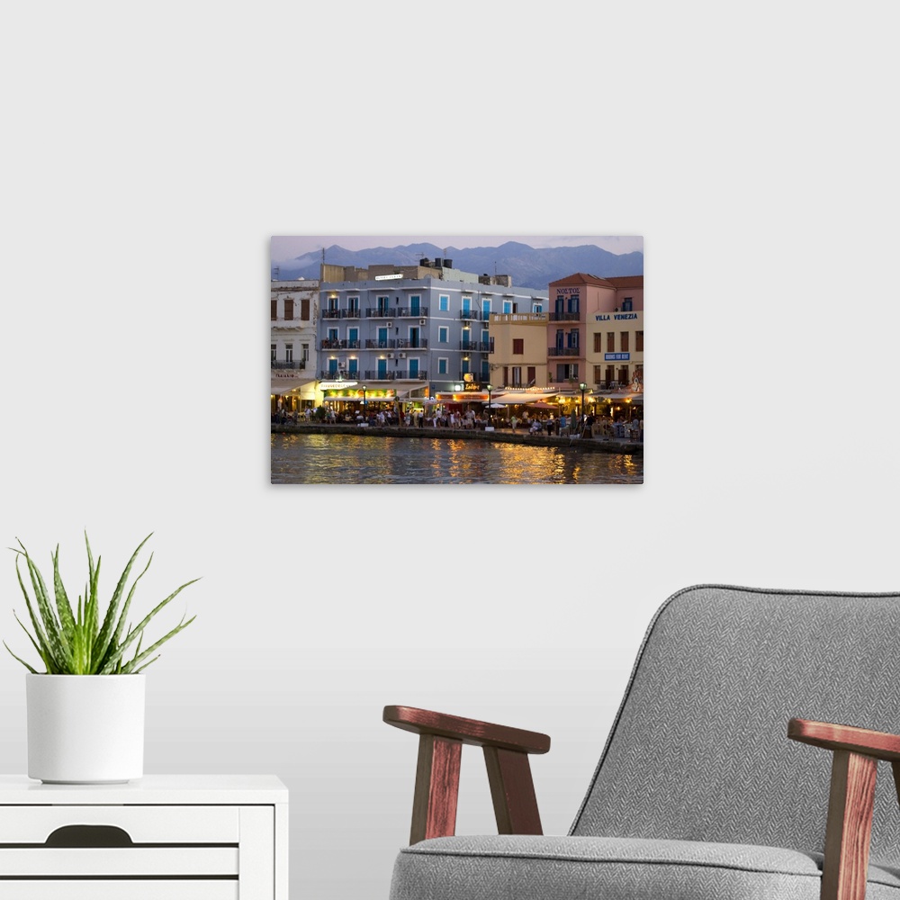 A modern room featuring Greek Island of Crete and old town of Chania evening light along the old harbor and the colorful ...