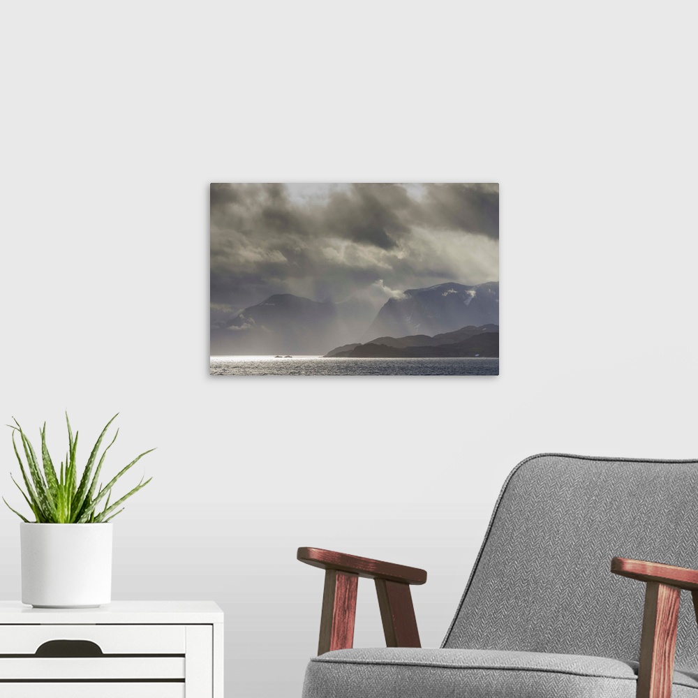 A modern room featuring Greenland, Kangerlussuaq. Low clouds over the fjord.