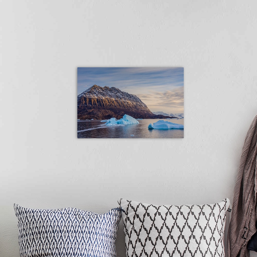 A bohemian room featuring Greenland. Scoresby Sund. Icebergs and deeply eroded mountains.