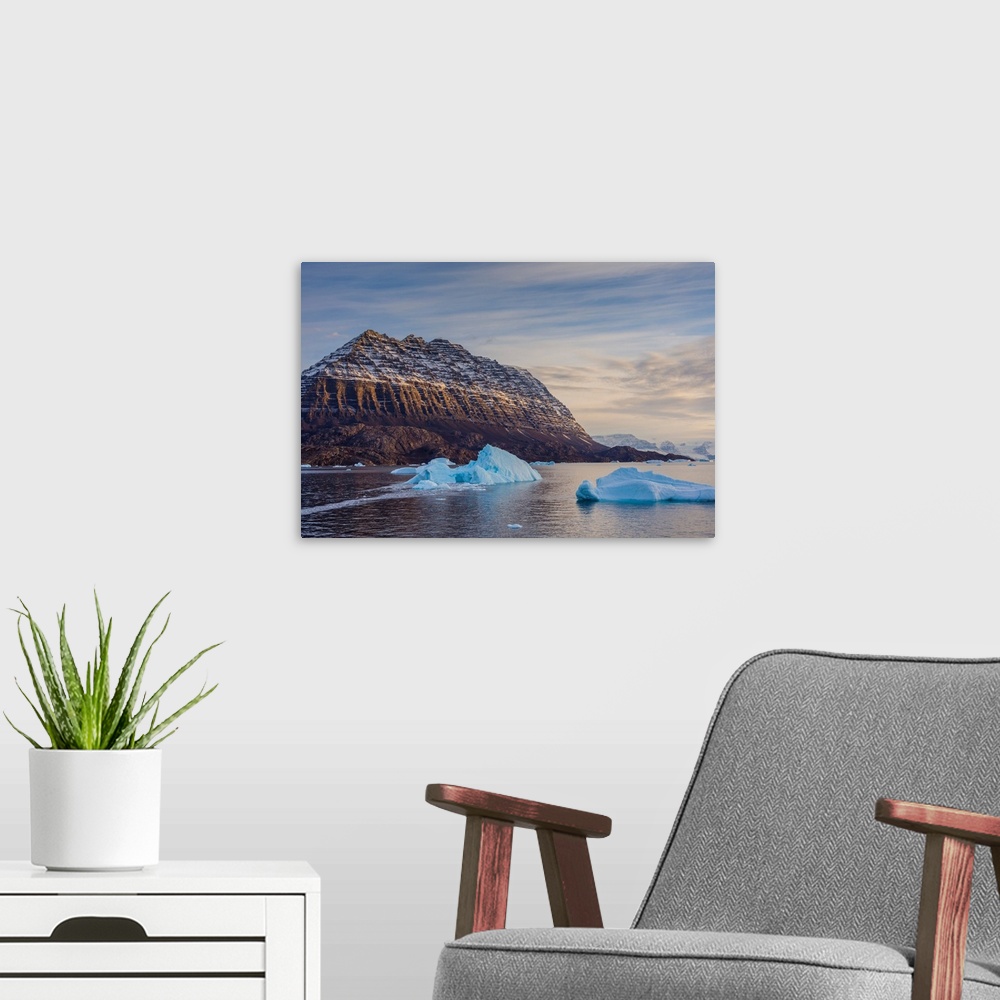 A modern room featuring Greenland. Scoresby Sund. Icebergs and deeply eroded mountains.