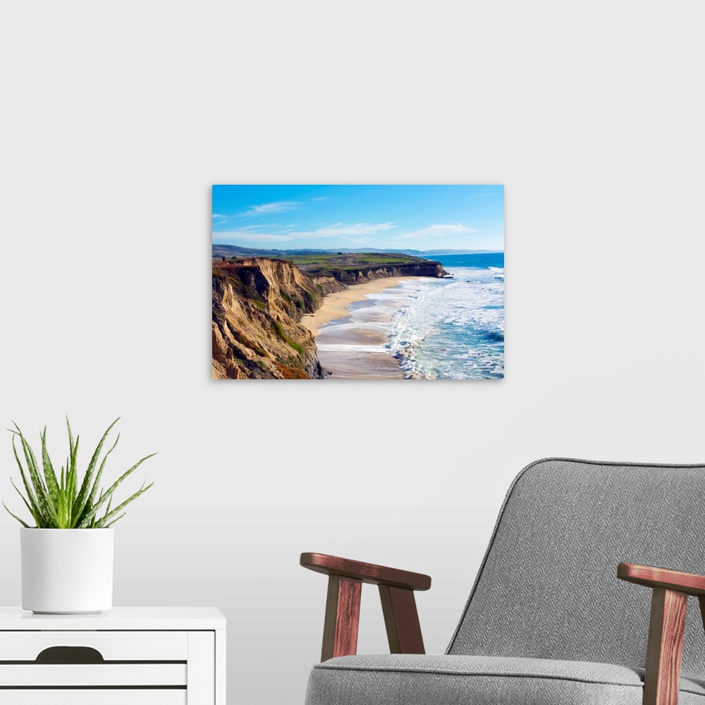 A modern room featuring Half Moon Bay California shore ocean cliffs off of the Ritz Golf Course with waves sand at Half M...