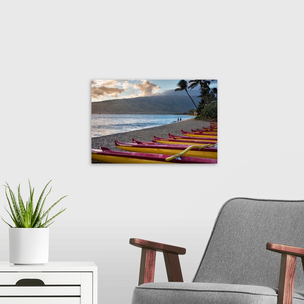 A modern room featuring Hawaii, Maui, Kihei. Traditional Hawaiian outrigger canoes in the foreground with people on Ka La...