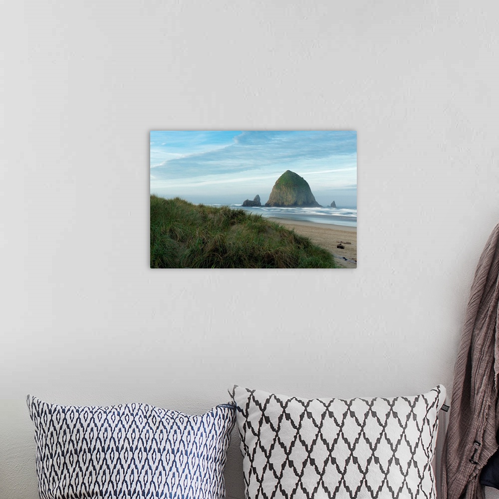 A bohemian room featuring Hay Stack Rock on the sandy beach at Cannon Beach, Oregon