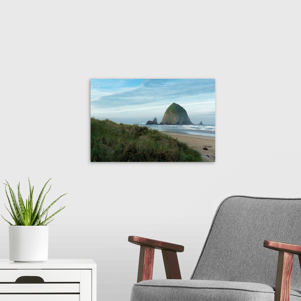 A modern room featuring Hay Stack Rock on the sandy beach at Cannon Beach, Oregon