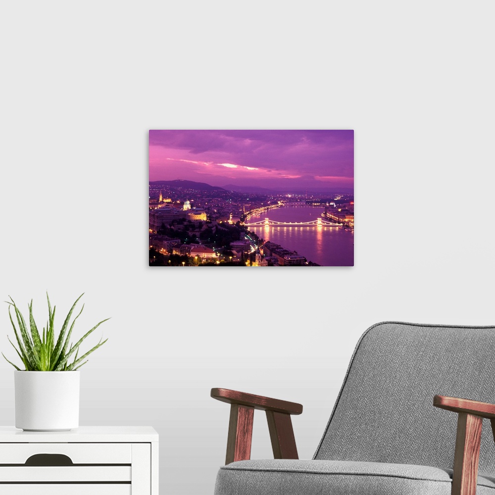 A modern room featuring Hungary, Budapest, City and Danube river at dusk.