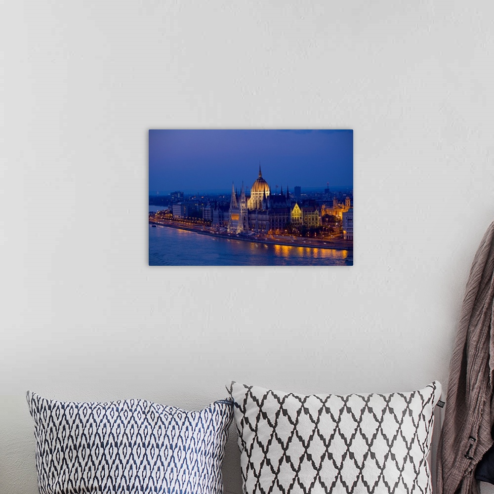 A bohemian room featuring Europe, Hungary, Budapest. Nighttime overview of the Parliament Building and city next to River D...
