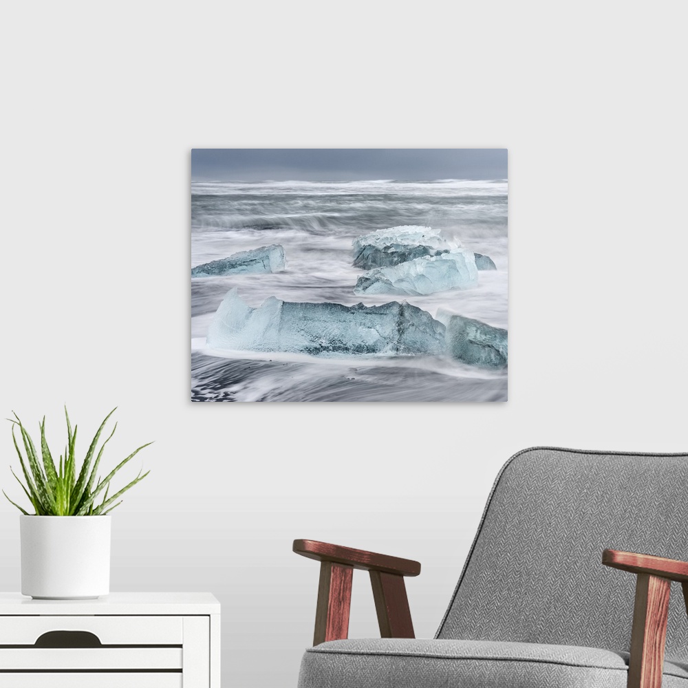 A modern room featuring Icebergs on black volcanic beach near the Jokulsarlon glacial lagoon and Breithamerkurjokull glac...
