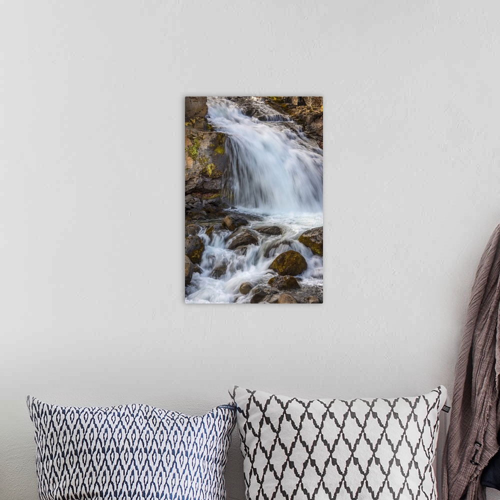 A bohemian room featuring Iceland contains an abundance of beautiful waterfalls.