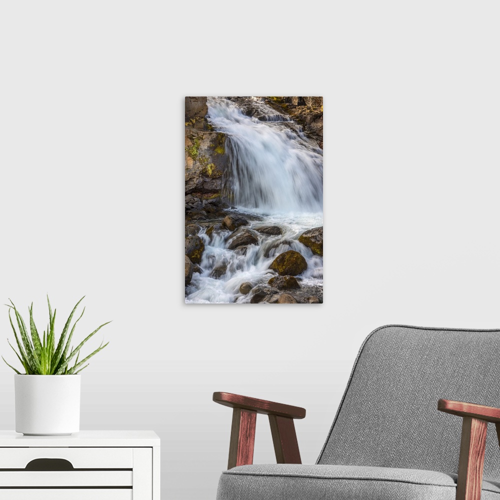 A modern room featuring Iceland contains an abundance of beautiful waterfalls.