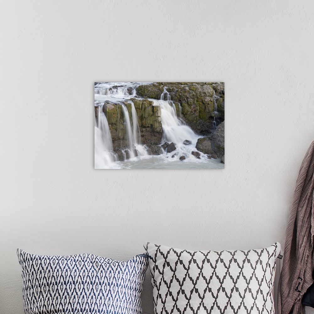 A bohemian room featuring Iceland, Gygjarfoss Waterfall Flows Through A Rather Barren Landscape