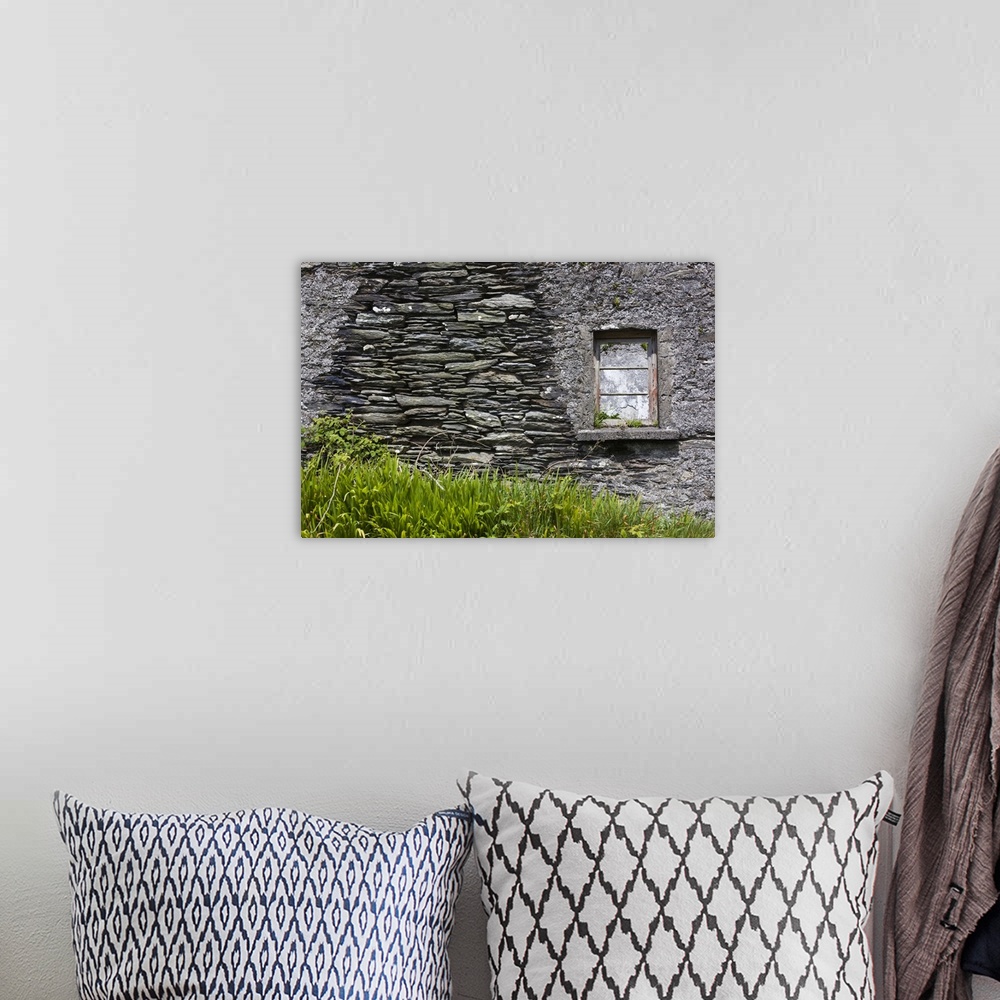 A bohemian room featuring Ireland, County Cork, Beara Peninsula, Ring of Beara, Garinish, traditional stone house detail.