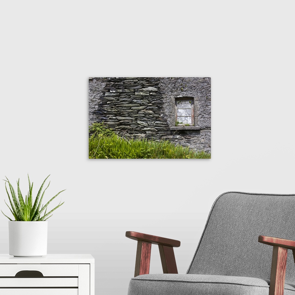 A modern room featuring Ireland, County Cork, Beara Peninsula, Ring of Beara, Garinish, traditional stone house detail.