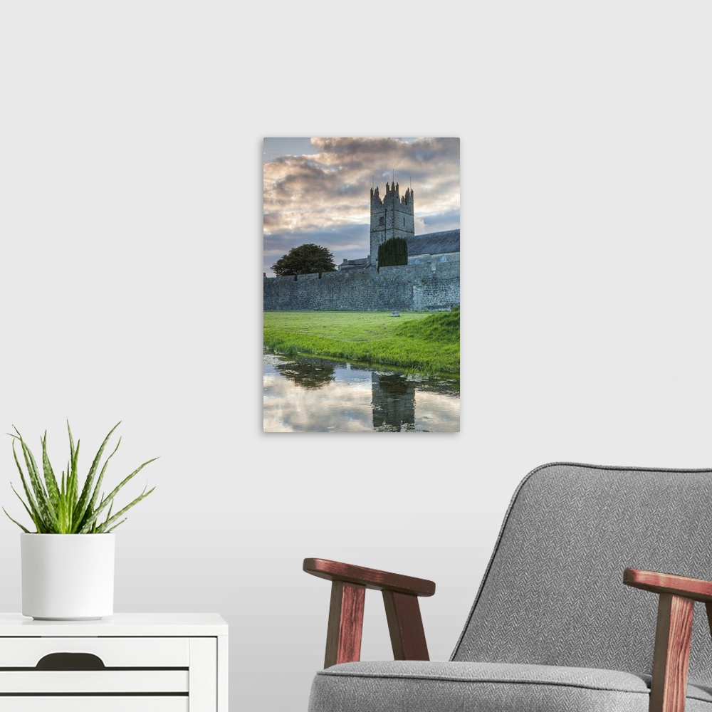 A modern room featuring Ireland, County Tipperary, Fethard, town walls, dusk.