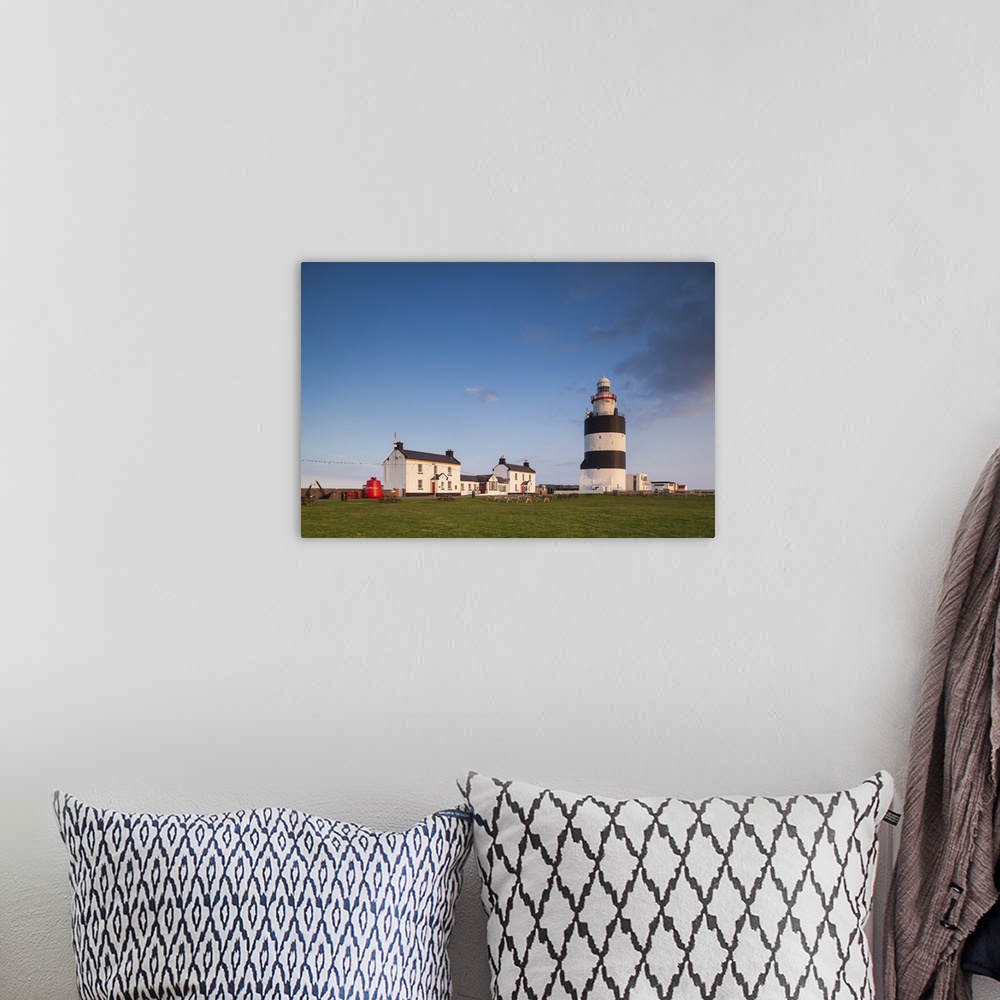 A bohemian room featuring Ireland, County Wexford, Hook Peninsula, Hook Head, Hook Head Lighthouse, sunset.