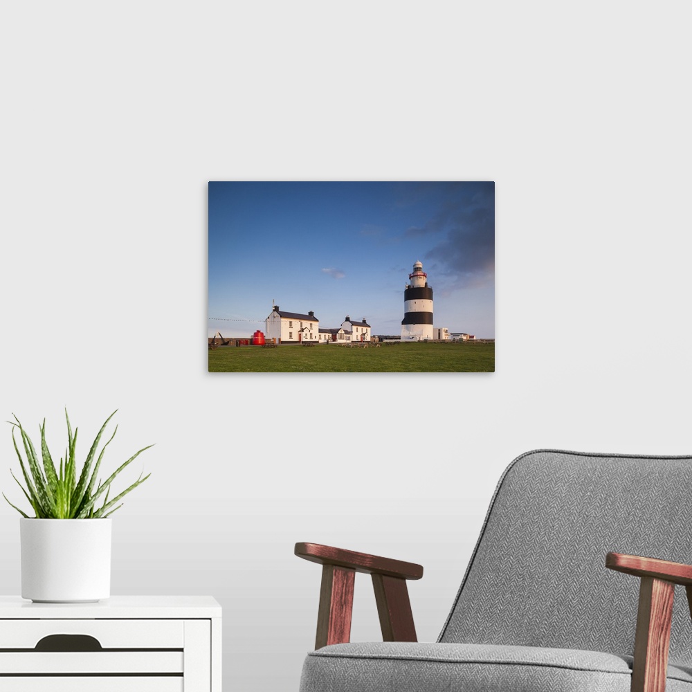 A modern room featuring Ireland, County Wexford, Hook Peninsula, Hook Head, Hook Head Lighthouse, sunset.