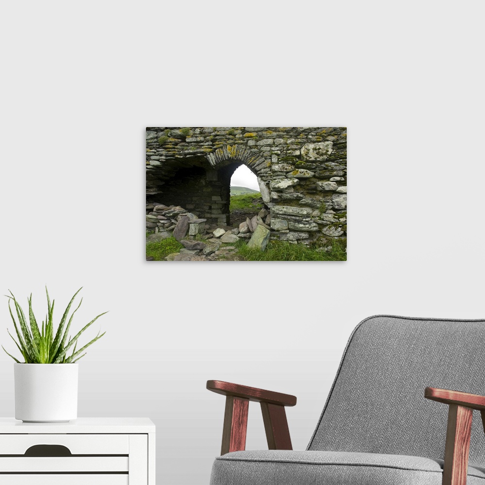 A modern room featuring IRELAND, Kerry, Ring of Kerry. Ballycarberry Castle, near Cahersiveen. Ruined archway.