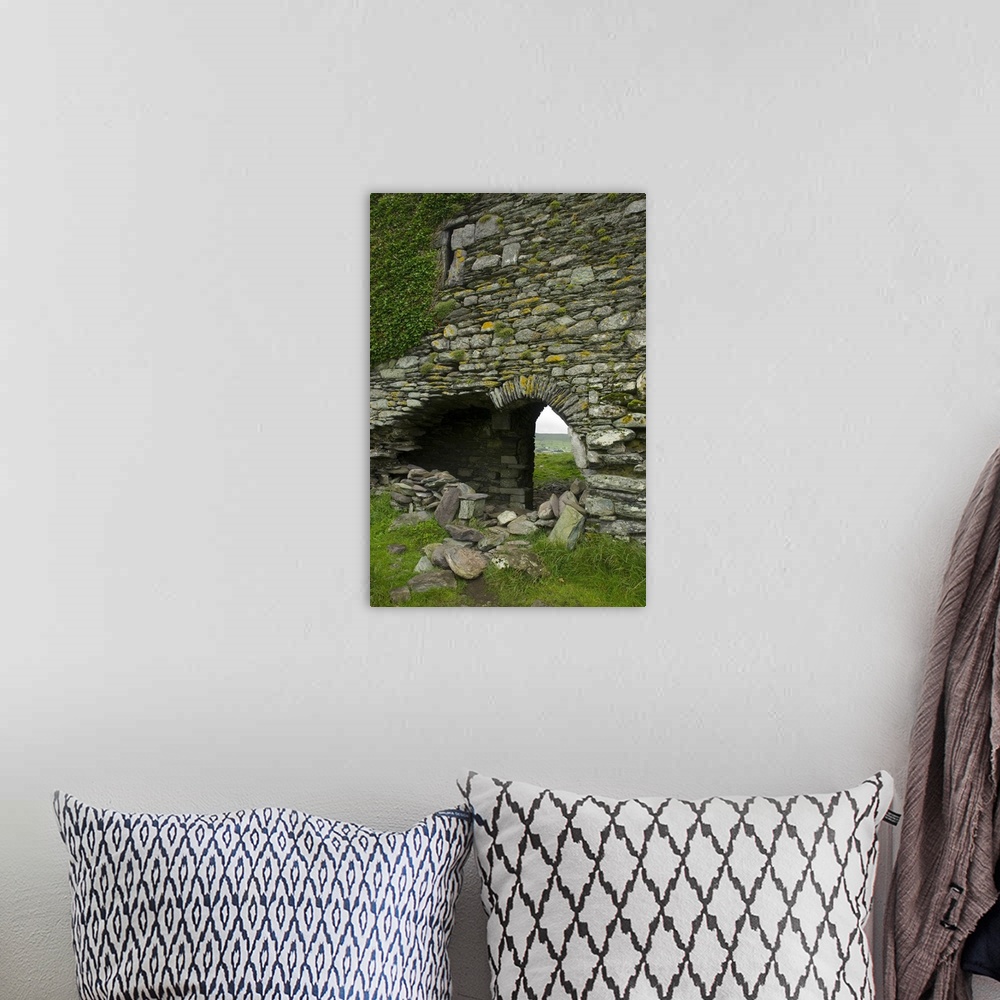 A bohemian room featuring IRELAND, Kerry, Ring of Kerry. Ballycarberry Castle, near Cahersiveen. Ruined archway.