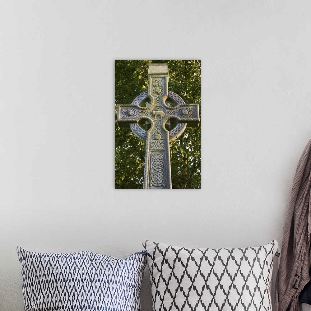 A bohemian room featuring Europe, Ireland, Roscommon. Celtic cross outside the Sacred Heart Church.  Credit as: Dennis Flah...