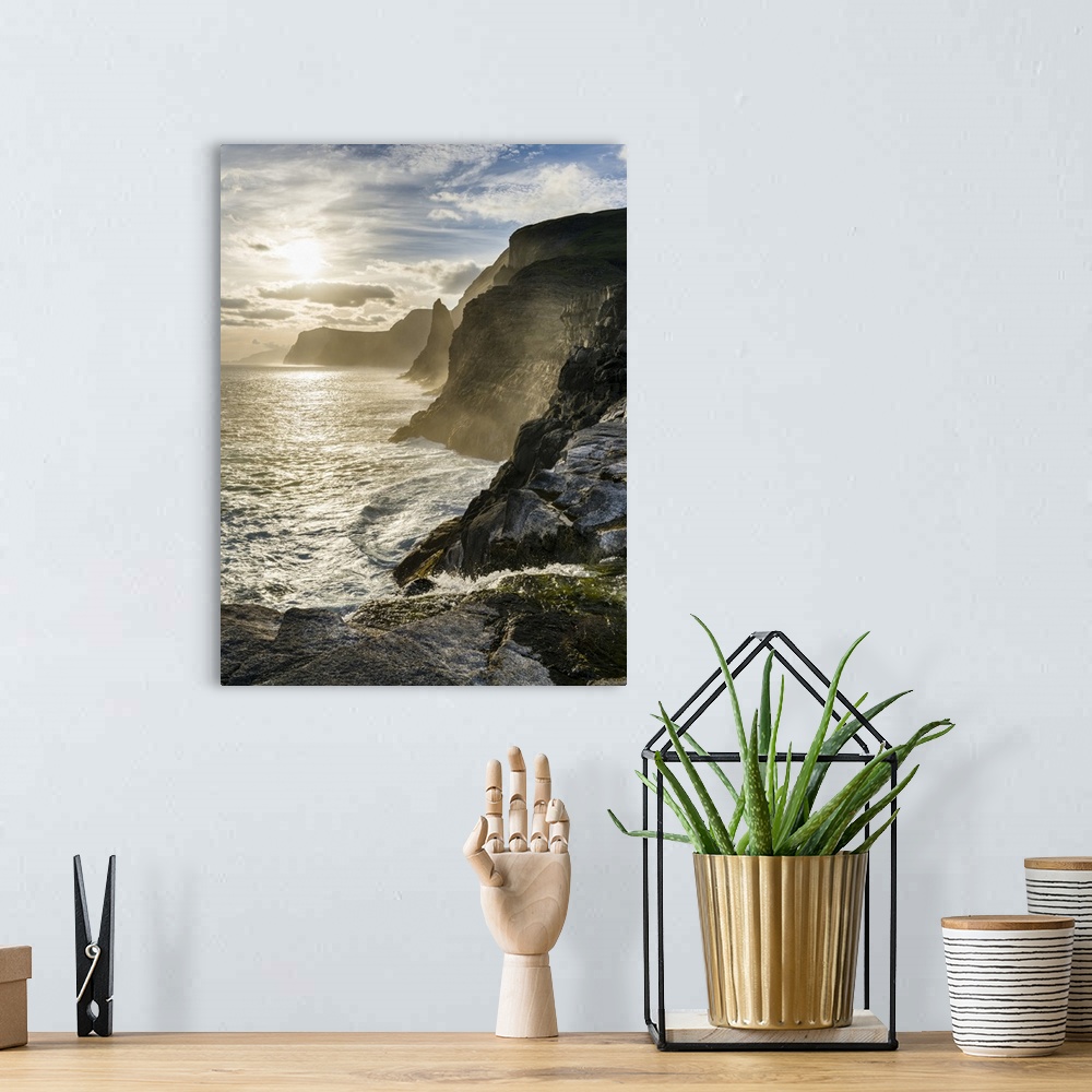 A bohemian room featuring The west coast near Traelanipa with waterfall Bosdalafossur at sunset. The island Vagar, part of ...
