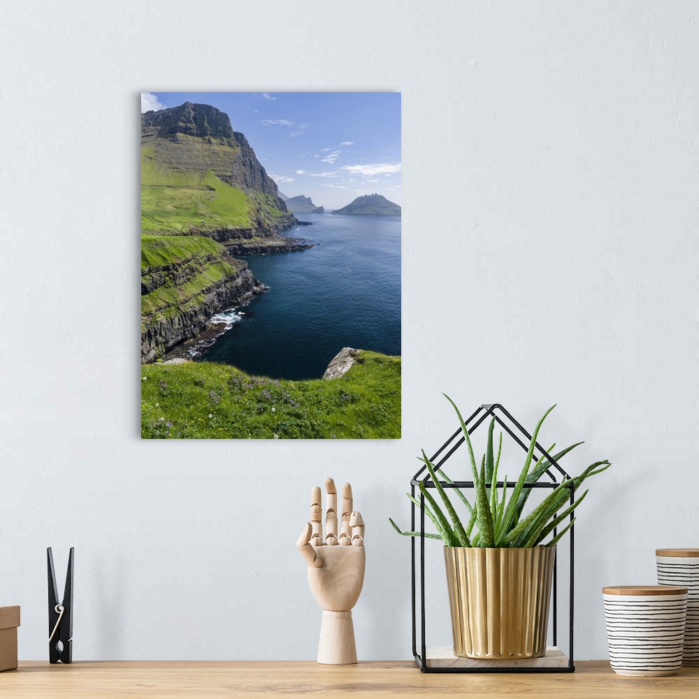 A bohemian room featuring The coast near Gasadalur. The island Vagar, part of the Faroe Islands in the North Atlantic. Euro...