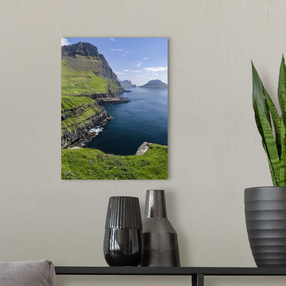A modern room featuring The coast near Gasadalur. The island Vagar, part of the Faroe Islands in the North Atlantic. Euro...
