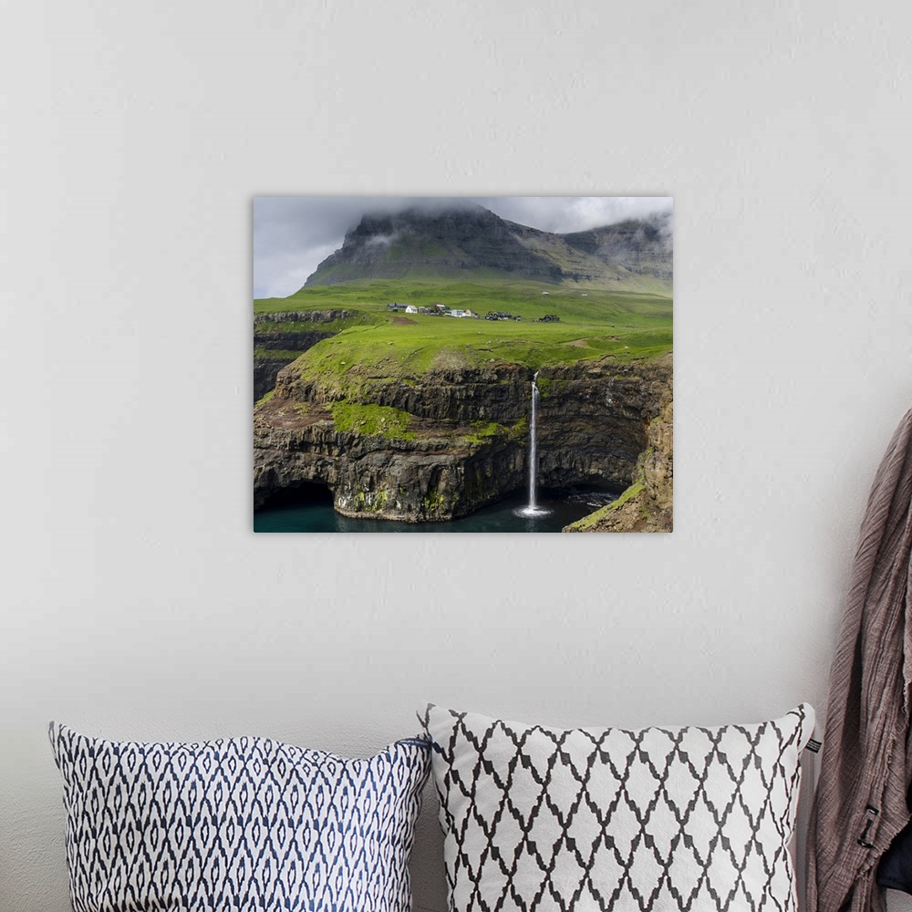 A bohemian room featuring The waterfall near Gasadalur, one of the landmarks of Faroe Islands. The island Vagar, part of th...