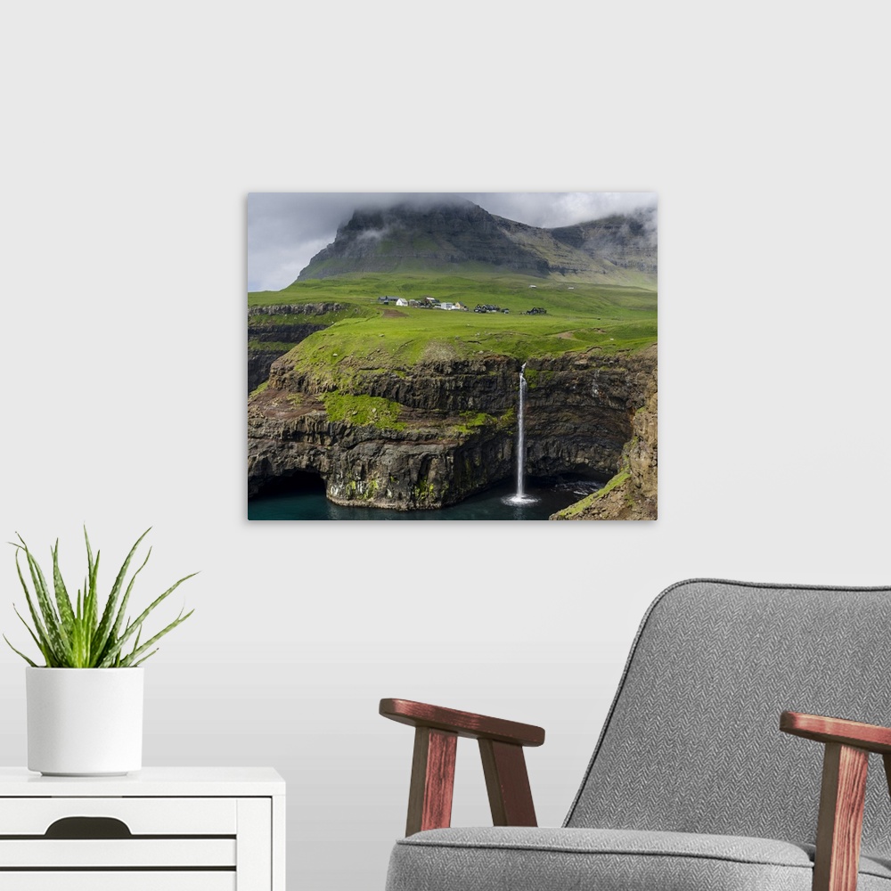 A modern room featuring The waterfall near Gasadalur, one of the landmarks of Faroe Islands. The island Vagar, part of th...