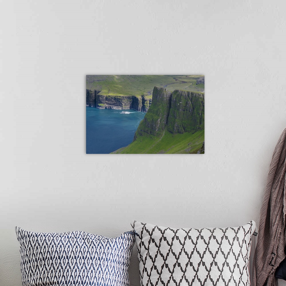 A bohemian room featuring The mountains of Vagar, part of the Faroe Islands. Europe, Northern Europe, Denmark, Faroe Islands.