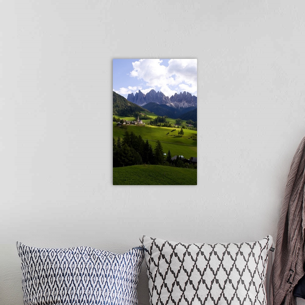 A bohemian room featuring Beautiful isolated lonely church St Maddalena and village in valley  in the Italian Dolomites vil...