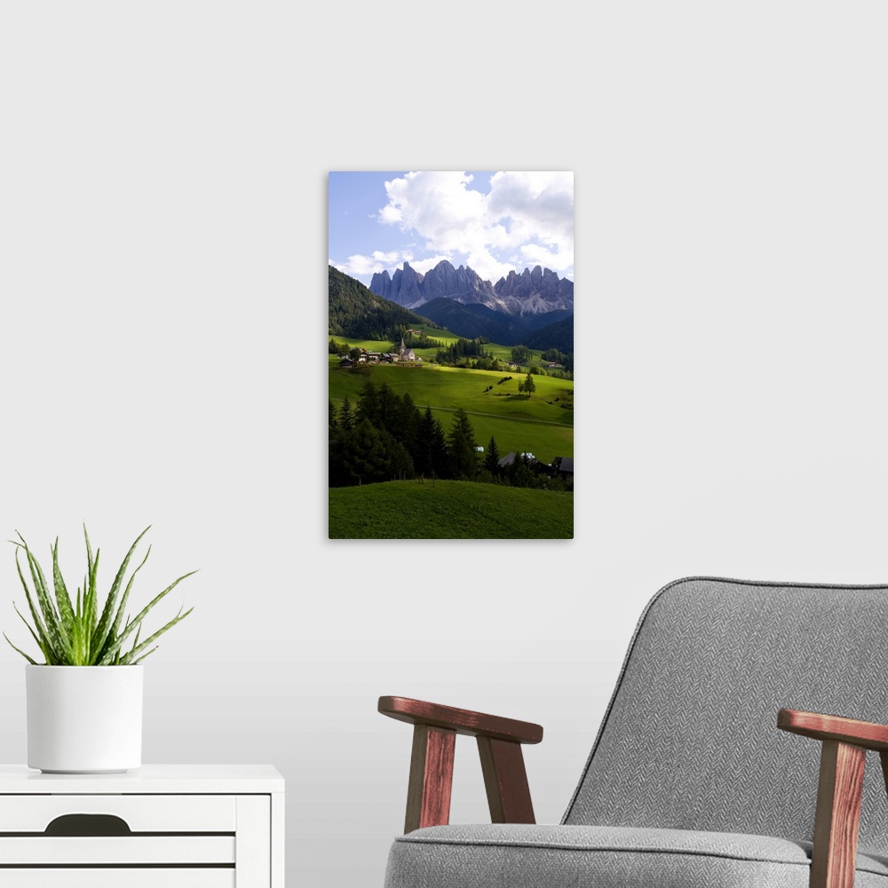 A modern room featuring Beautiful isolated lonely church St Maddalena and village in valley  in the Italian Dolomites vil...