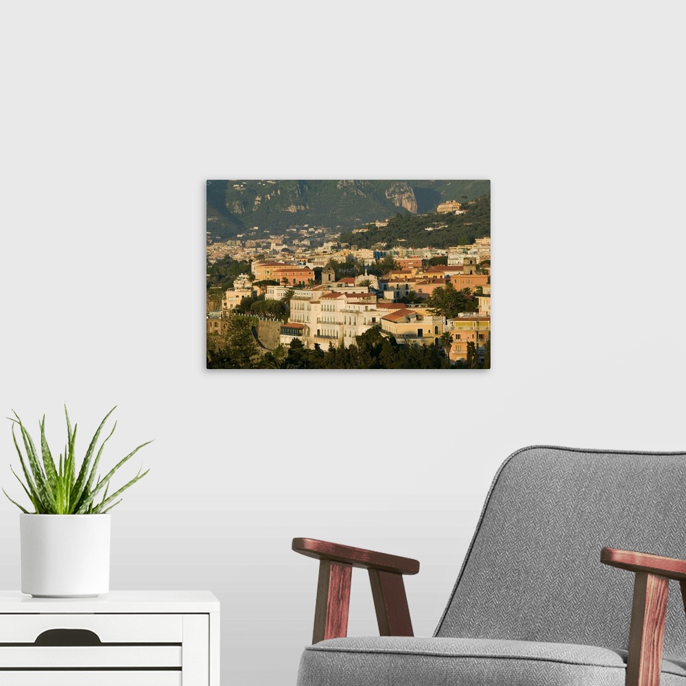A modern room featuring ITALY-Campania-(Sorrento Peninsula)-SORRENTO:.Sunset View of Marina Grande Area... Walter Bibikow...