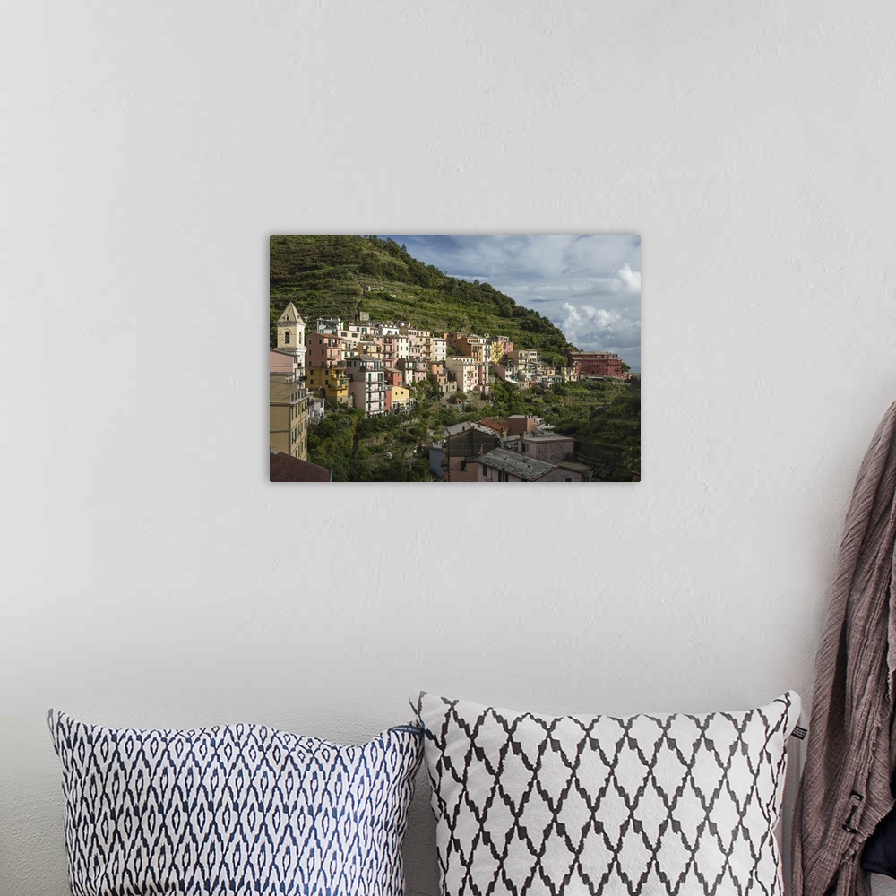 A bohemian room featuring Italy, Cinque Terre, Manarola. View of housing amidst the steep hillsides.