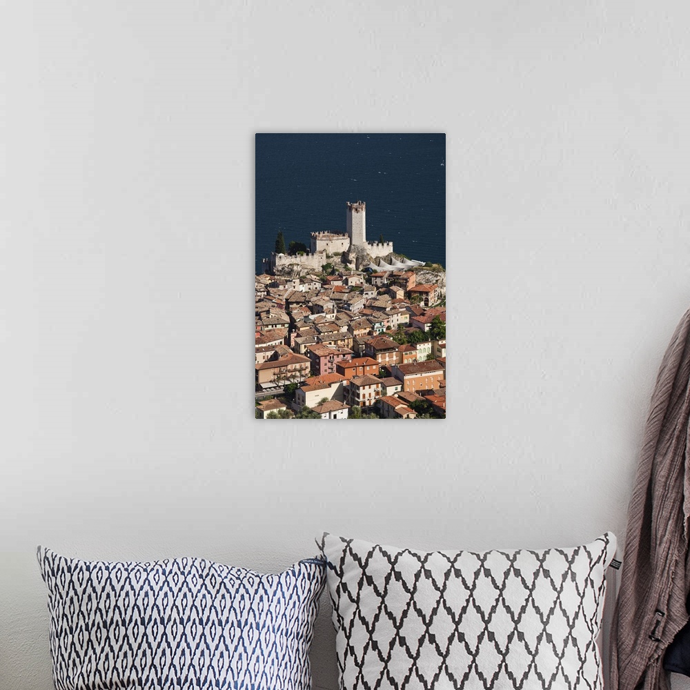 A bohemian room featuring ITALY, Verona Province, Malcesine. Aerial town view and Castello Scaligero from Monte Baldo.